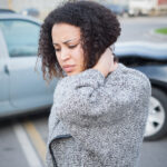 Injured woman feeling bad after having car crash Injured woman feeling bad after having car crash