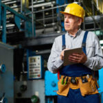 Senior Factory Worker Using Tablet