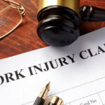 Worker compensation. Work injury claim on a table.