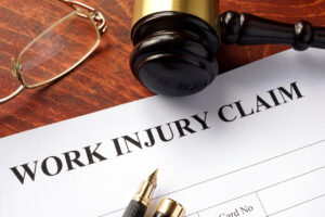 Worker compensation. Work injury claim on a table.